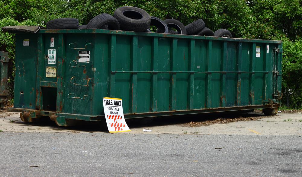 A,Large,Metal,Tire,Recycling,Dumpster,Outside,For,Tire,Disposal