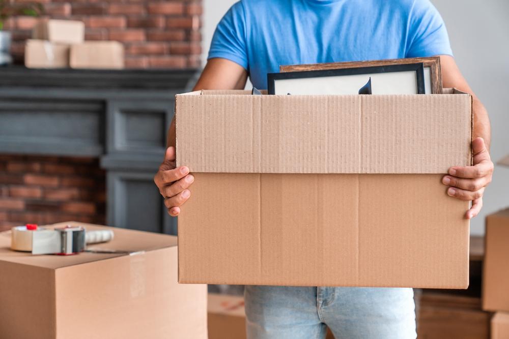 Cropped,Image,Of,Man,Carrying,Boxes,Full,Of,Stuff,Moving